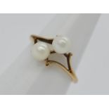 A 9ct gold and double pearl dress ring, size I, approximately 1.3 grams all in.