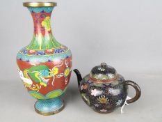 A cloisonné vase with depiction of a dragon chasing the flaming pearl and a cloisonné teapot with