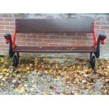 A garden bench seat with wooden planked back and seat,