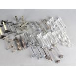 A good selection of sixteen pairs of knife rests to include cut glass, plated,