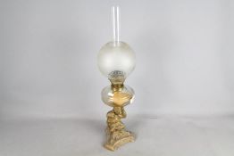 A good quality oil lamp, the support column in the form of a bear holding the oil font,