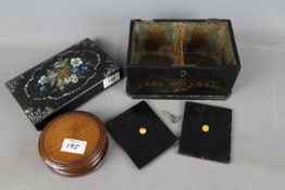 An Edwardian black lacquered tea caddy with inset mother of pearl decoration,