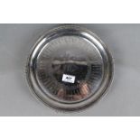 A hallmarked silver salver raised on three supports, marks rubbed but probably Perth assay, 573 gm,