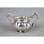 A silver twin-handled bowl raised on four scrolled supports, impressed import marks to the base,