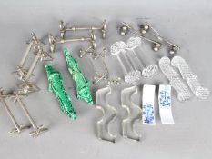 Ten pairs of knife rests to include cut glass examples, hallmarked silver, white metal and other.