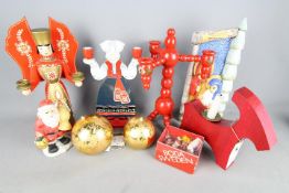 A collection of Christmas decorations to include Expertic Erzgebirge candle Angel, Rotor Sweden,