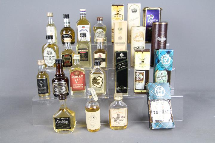 Twenty five whisky miniatures, predominantly Scotch to include Jura, Cardhu, Suntory Reserve,