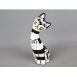 Lorna Bailey Pottery - a figurine depicting a black and white striped Cat, signed to lower rear,