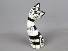 Lorna Bailey Pottery - a figurine depicting a black and white striped Cat, signed to lower rear,