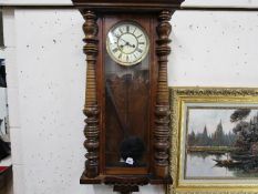 A late 19th / early 20th century Vienna style walnut cased wall clock,