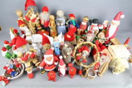 A collection of traditional Christmas decorations to include Swedish straw, ceramic,