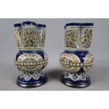 Doulton Lambeth - A pair of late 19th / early 20th century vases,
