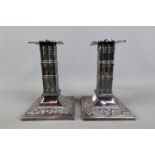 A pair of William Tonks & Sons silver plated column candlesticks, approximately 16 cm (h).