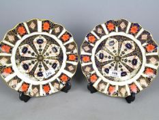 Royal Crown Derby - a pair of Royal Crown Derby cabinet plates decorated in the Imari palette,