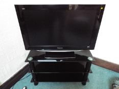 Panasonic - a 32 inch television set model TX-32L2D85 (Please Note - Glass display cabinet is not