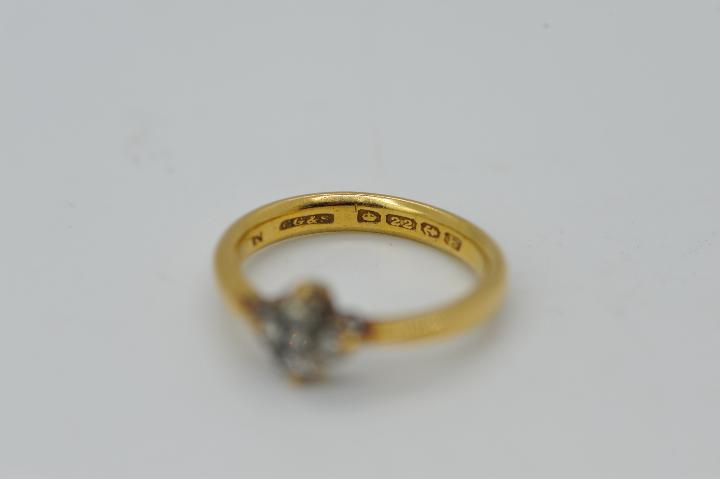 A 22ct gold ring set with a cluster of diamonds, size L, approximately 4 grams all in. - Image 4 of 4