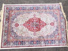 An ivory ground Kashmir carpet / rug, approximately 170 cm x 120 cm.