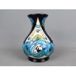 Moorcroft Pottery - a large vase with flared rim decorated in the Rennie Rose Blue pattern,