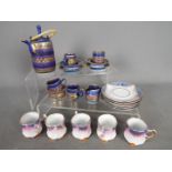 A pottery miniature coffee set and a quantity of Martinroda cups and saucers.