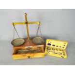 A vintage set of jewellers scales by Arnold Precision Scales, Redhill and a set of weights in case.