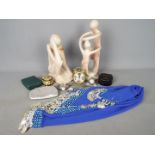 A mixed lot to include two stone sculptures, clocks, belly dancing hip skirt, watches, stud box,