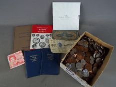 A large quantity of coins, UK and foreign, commemorative crowns and similar.