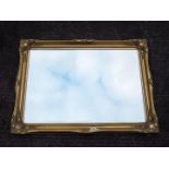 A gilt framed, bevel edged wall mirror, approximately 76 cm x 105 cm.