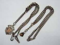 Two silver watch chains, one with silver fob.