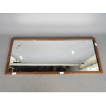 A vintage LMS wall or carriage mirror, the glass etched LMS and impressed to the frame,