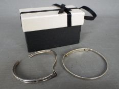 Two silver bangles,
