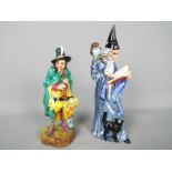 Royal Doulton - Two Royal Doulton figurines comprising The Wizard HN2877 and The Mask Seller HN2103,