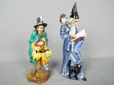 Royal Doulton - Two Royal Doulton figurines comprising The Wizard HN2877 and The Mask Seller HN2103,