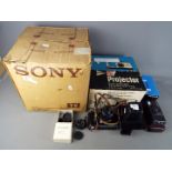 A vintage Sony television, model 9 90UB in original box, a boxed slide projector,