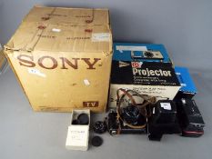 A vintage Sony television, model 9 90UB in original box, a boxed slide projector,