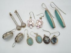 Six pairs of silver earrings