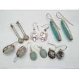 Six pairs of silver earrings