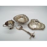 A collection of hallmarked silver items to include a set of Edward VII pickle tongs / pincers,