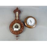 Two wall hanging aneroid barometers [2]