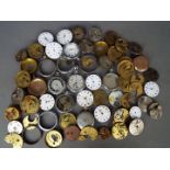 A quantity of pocket watch movements, dials and parts.