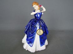 A Royal Doulton figurine entitled Laura, approx height 19.