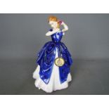 A Royal Doulton figurine entitled Laura, approx height 19.