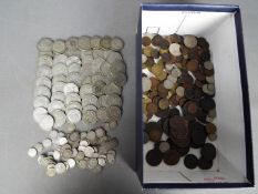 A collection of pre-decimalisation UK coins, many with silver content.