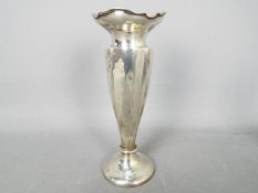 A George V hallmarked silver vase, Chester assay 1929, sponsors mark for Walker & Hall,