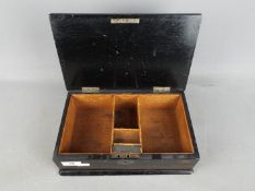A Victorian trinket / cigarette box with hallmarked silver mounts, London assay 1897,