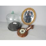 Lot to include a glass dome and stand, barometer with carved case and mirror.