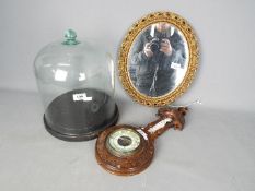 Lot to include a glass dome and stand, barometer with carved case and mirror.