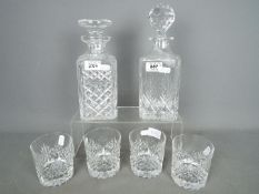 An Edinburgh International Crystal decanter and four tumblers and one further decanter by Stuart
