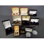 A collection of various cufflinks (including a hallmarked silver pair) and dress studs and two
