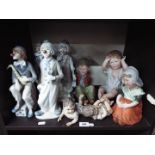 Lot to include Spanish clown figurines and a quantity of piano babies.
