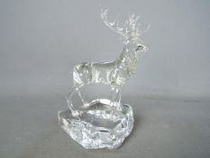 A studio glass, lamp worked figurine by Neil Harris depicting a stag, signed and dated to the base,
